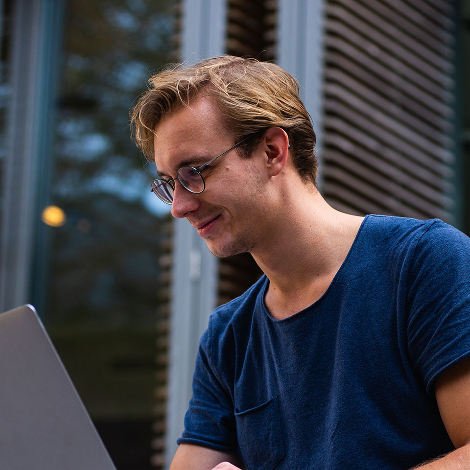 A man comparing loans on his laptop